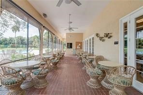 9632 Riverside Drive, Unit 2 Sebastian, FL 32958 - Photo 27 of 29 a living room with furniture large windows and wooden floor