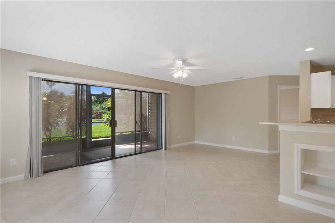 9632 Riverside Drive, Unit 2 Sebastian, FL 32958 - Photo 7 of 29 an empty room with floor to ceiling window and an outdoor view