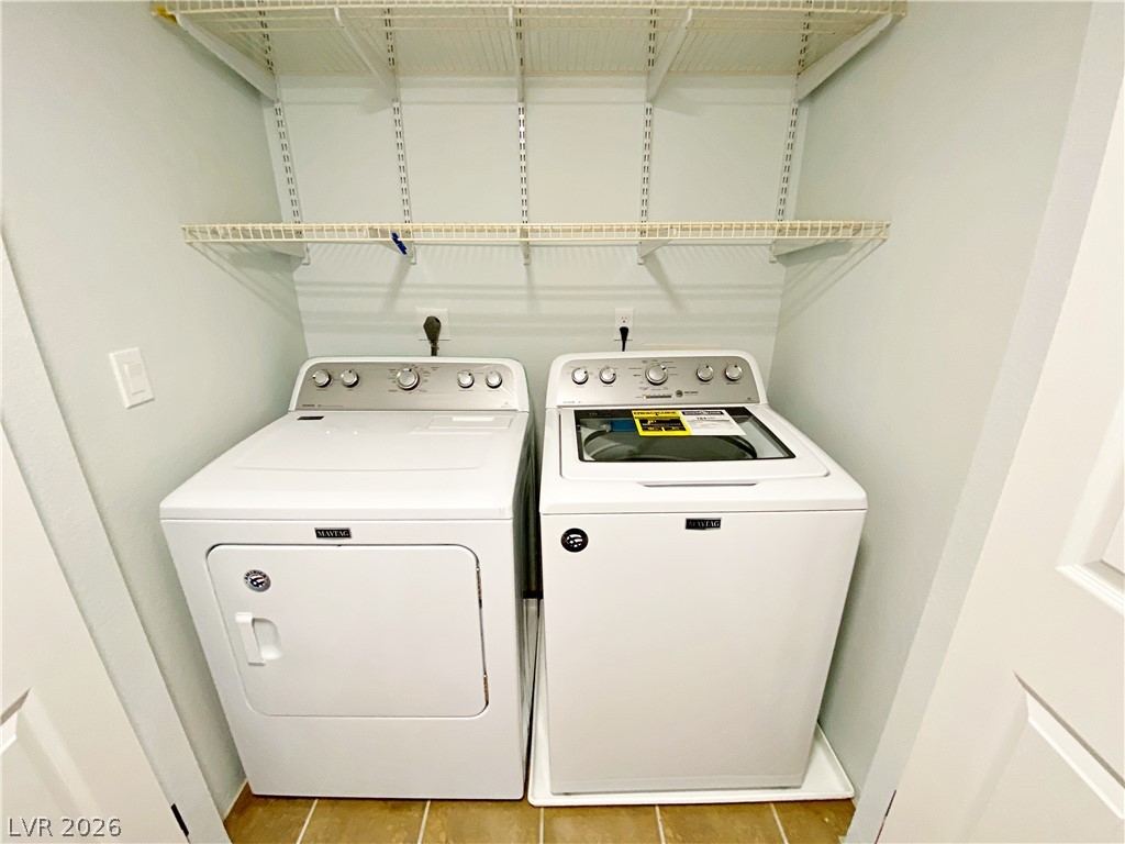 1575 West Warm Springs Road, Unit 1024 Henderson, NV 89014 - Photo 25 of 25 Functional laundry nook with shelving provides practical utility.