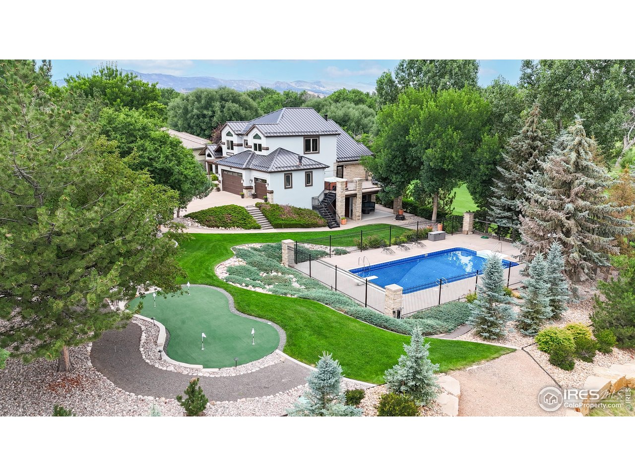 898 Eagle Ridge Court Loveland, CO 80537 - Photo 1 of 40 a aerial view of a house with swimming pool garden and patio