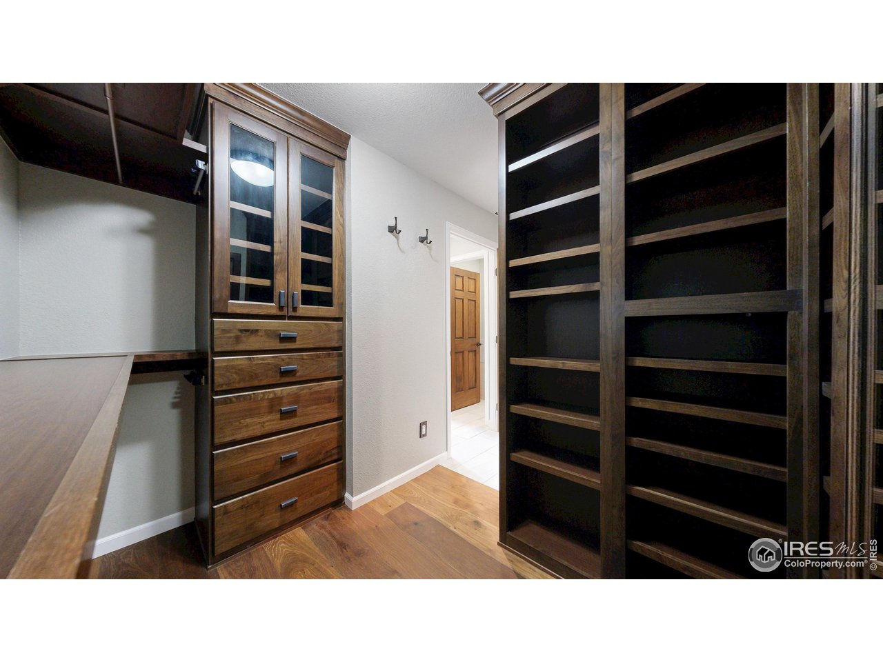 898 Eagle Ridge Court Loveland, CO 80537 - Photo 18 of 40 a room with walk in closet and wooden floor