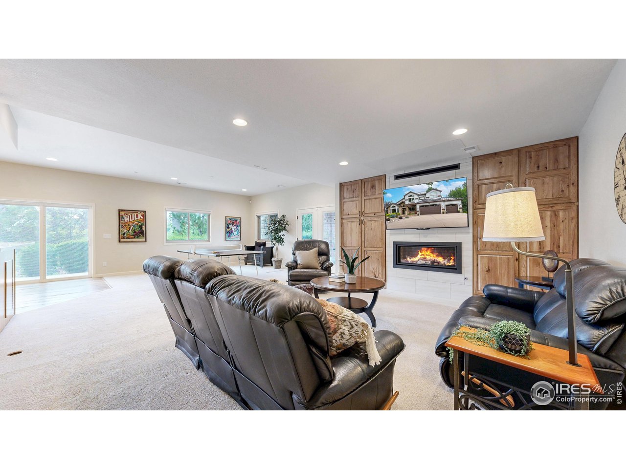 898 Eagle Ridge Court Loveland, CO 80537 - Photo 32 of 40 a living room with furniture and a table