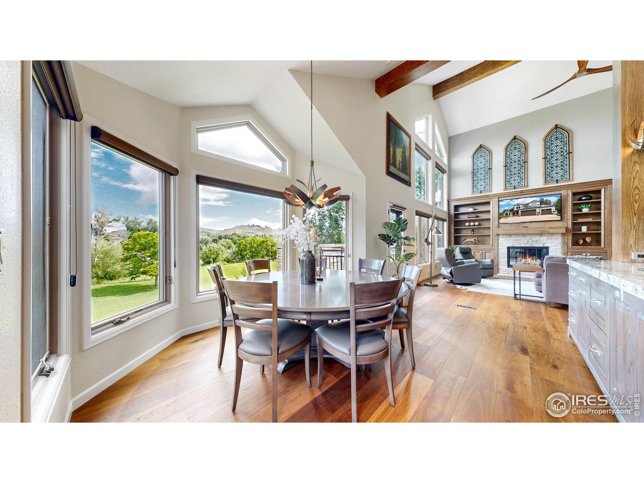 898 Eagle Ridge Court Loveland, CO 80537 - Photo 6 of 40 a view of a dining room with furniture window and wooden floor