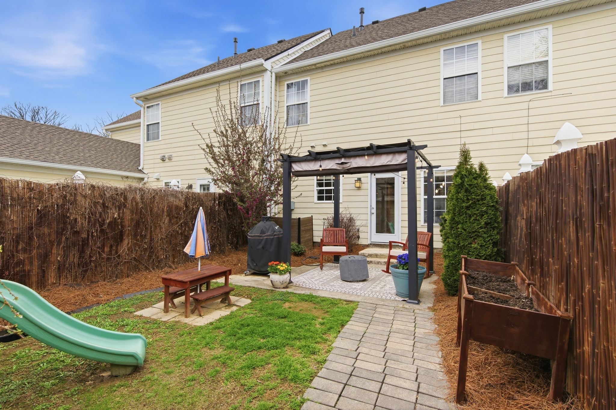 1505 Tolkien Lane Nashville, TN 37211 - Photo 26 of 27 a view of a backyard with chairs potted plants and wooden fence