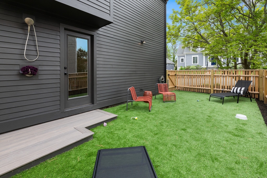 9 Upland Road Marblehead, MA 01945 - Photo 34 of 42 a backyard of a house with seating space