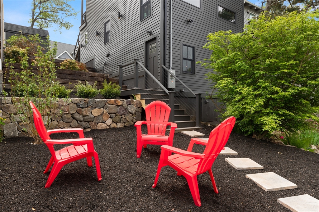 9 Upland Road Marblehead, MA 01945 - Photo 37 of 42 a backyard with tables and chairs