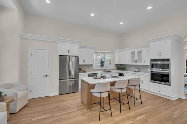 a kitchen with a table and chairs in it