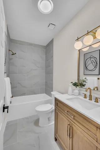 a bathroom with a sink a toilet and a bathtub