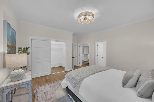 a bedroom with a bed and chair