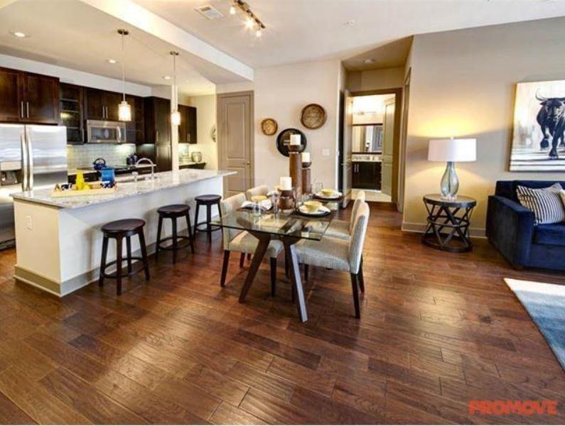 4600 Roswell Road, Unit 459 Sandy Springs, GA 30342 - Photo 4 of 7 a view of a dining room with furniture window and wooden floor