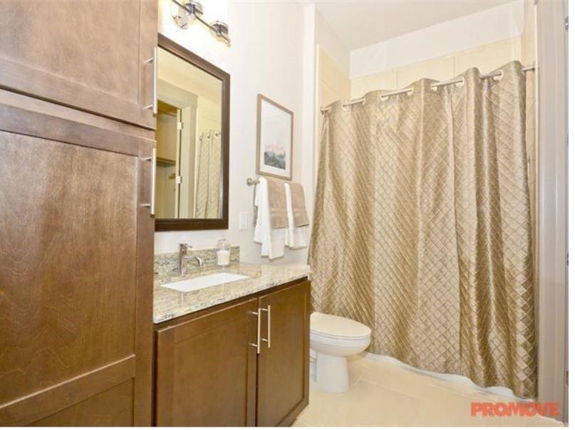 4600 Roswell Road, Unit 459 Sandy Springs, GA 30342 - Photo 6 of 7 a bathroom with a granite countertop sink and a mirror