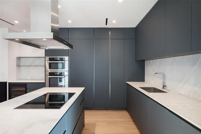 a kitchen with a sink and a refrigerator