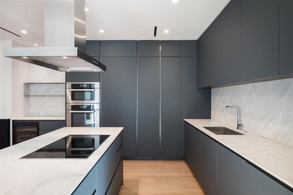 3515 Edgewater Street Dallas, TX 75205 - Photo 11 of 40 a kitchen with a sink and a refrigerator
