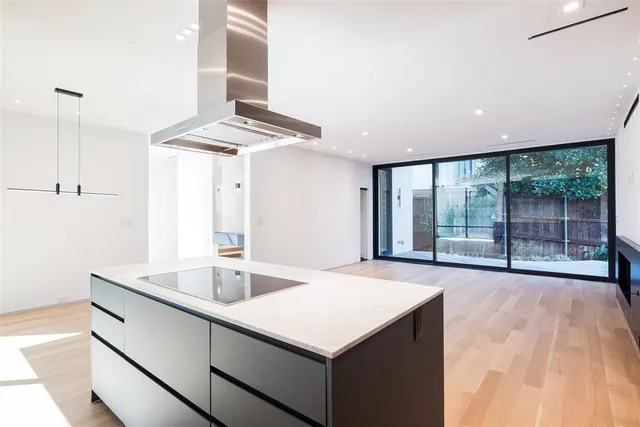 a kitchen with a sink and large window
