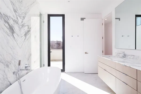 a en suite bathroom with a sink and a mirror