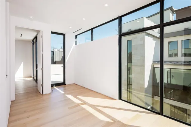 a view of an entryway with wooden floor