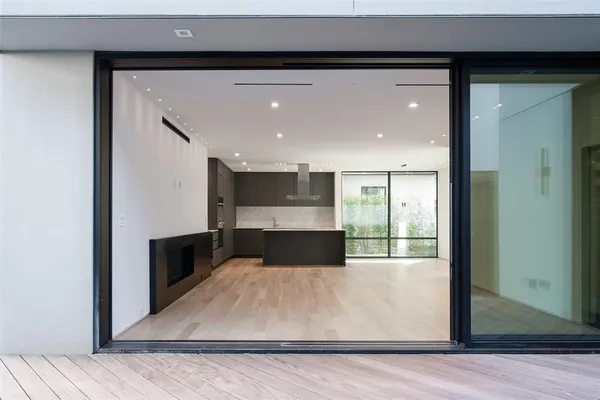 a view of a living room with a wooden floor