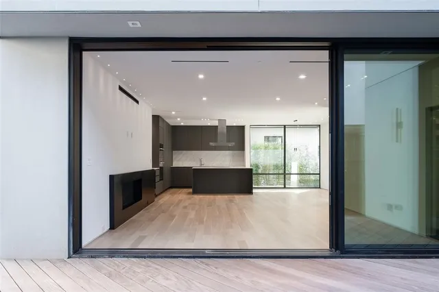a view of a living room with a wooden floor