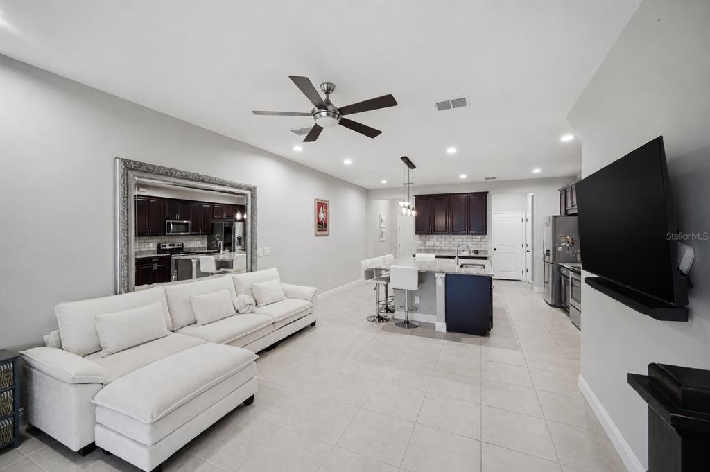 2013 Sunset Wind Loop Oldsmar, FL 34677 - Photo 6 of 43 a living room with furniture and a flat screen tv