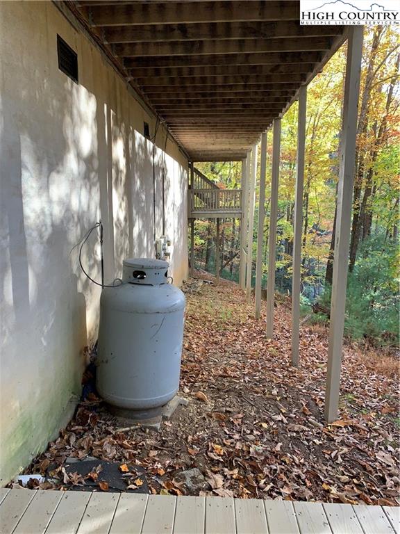 117 Horseshoe Ridge Road East Deep Gap, NC 28618 - Photo 11 of 50 a view of a porch with furniture and floor