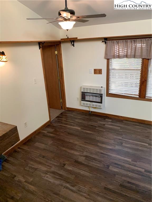 117 Horseshoe Ridge Road East Deep Gap, NC 28618 - Photo 18 of 50 a view of an empty room with wooden floor and a window