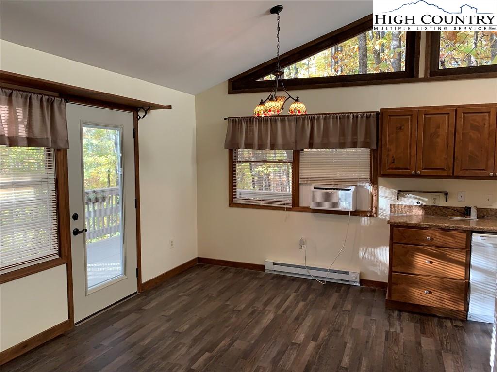 117 Horseshoe Ridge Road East Deep Gap, NC 28618 - Photo 19 of 50 a kitchen with stainless steel appliances wooden floors and view of living room