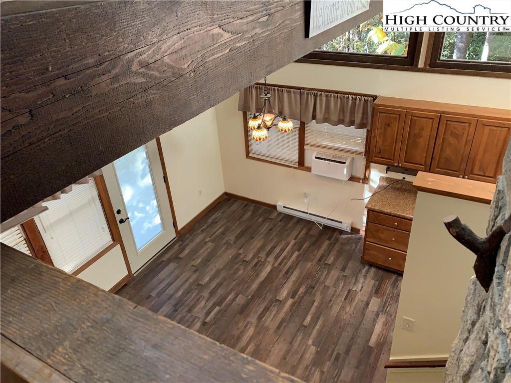 117 Horseshoe Ridge Road East Deep Gap, NC 28618 - Photo 23 of 50 a view of staircase with wooden floor and railing