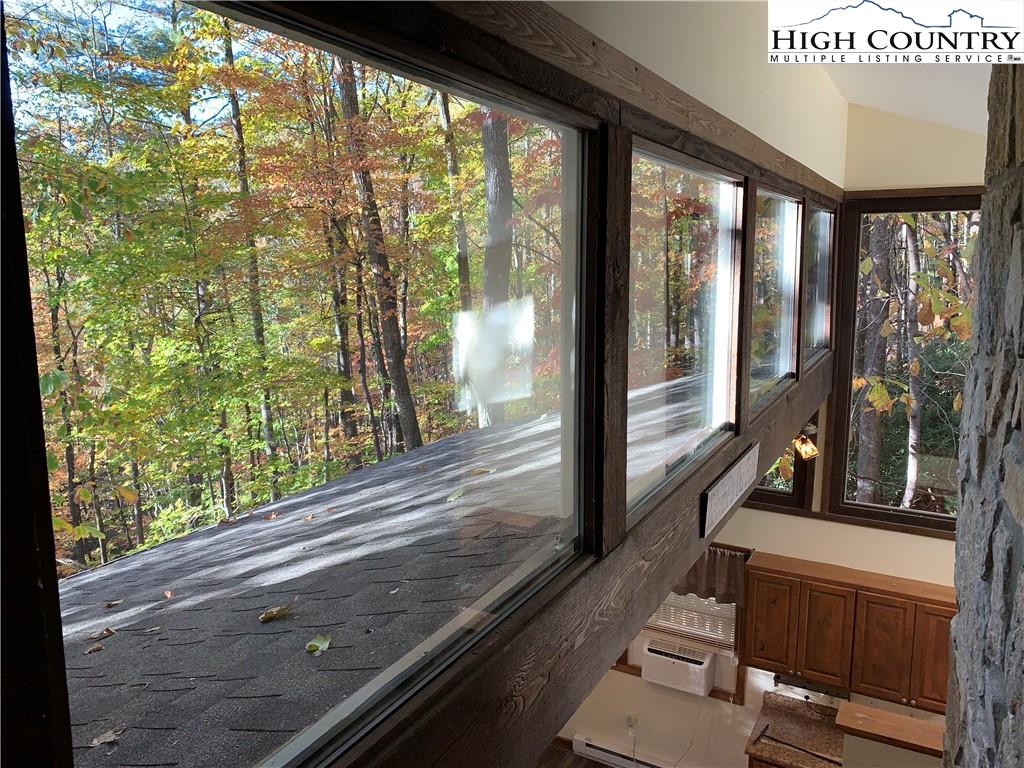 117 Horseshoe Ridge Road East Deep Gap, NC 28618 - Photo 25 of 50 a view of a balcony with wooden floor