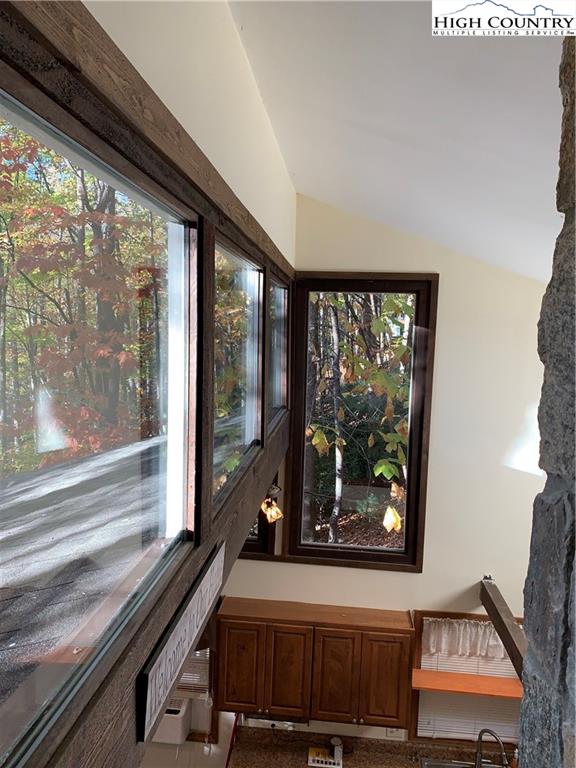 117 Horseshoe Ridge Road East Deep Gap, NC 28618 - Photo 26 of 50 a view of a room with a large window and furniture