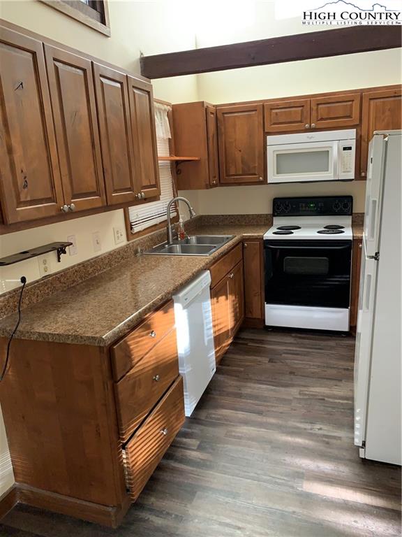 117 Horseshoe Ridge Road East Deep Gap, NC 28618 - Photo 27 of 50 a kitchen with granite countertop a stove and a sink