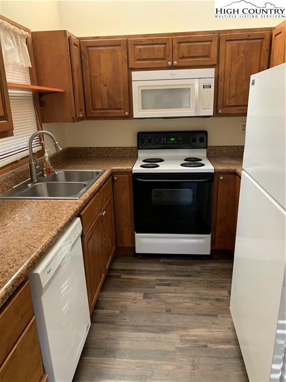 117 Horseshoe Ridge Road East Deep Gap, NC 28618 - Photo 29 of 50 a kitchen with stainless steel appliances granite countertop a stove a microwave and a sink