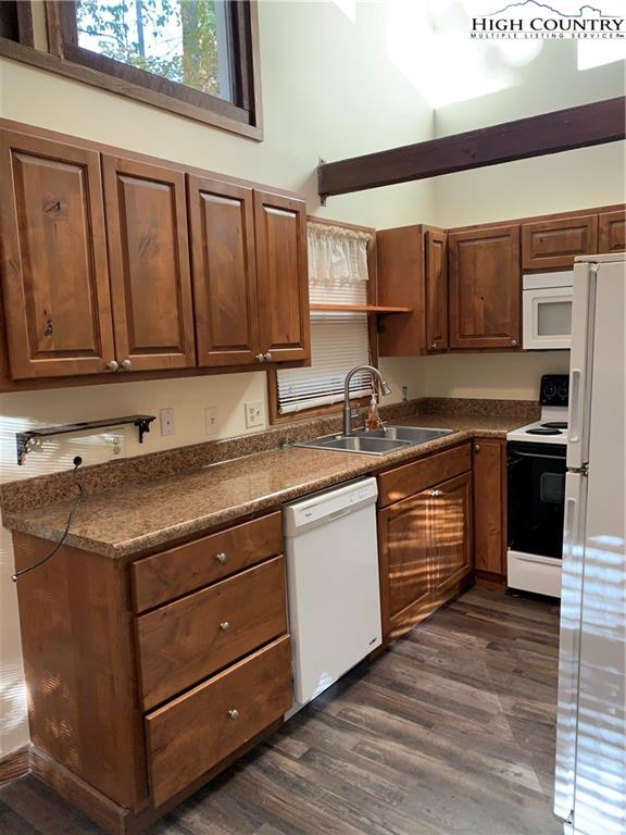 117 Horseshoe Ridge Road East Deep Gap, NC 28618 - Photo 30 of 50 a kitchen with stainless steel appliances granite countertop a sink and a stove