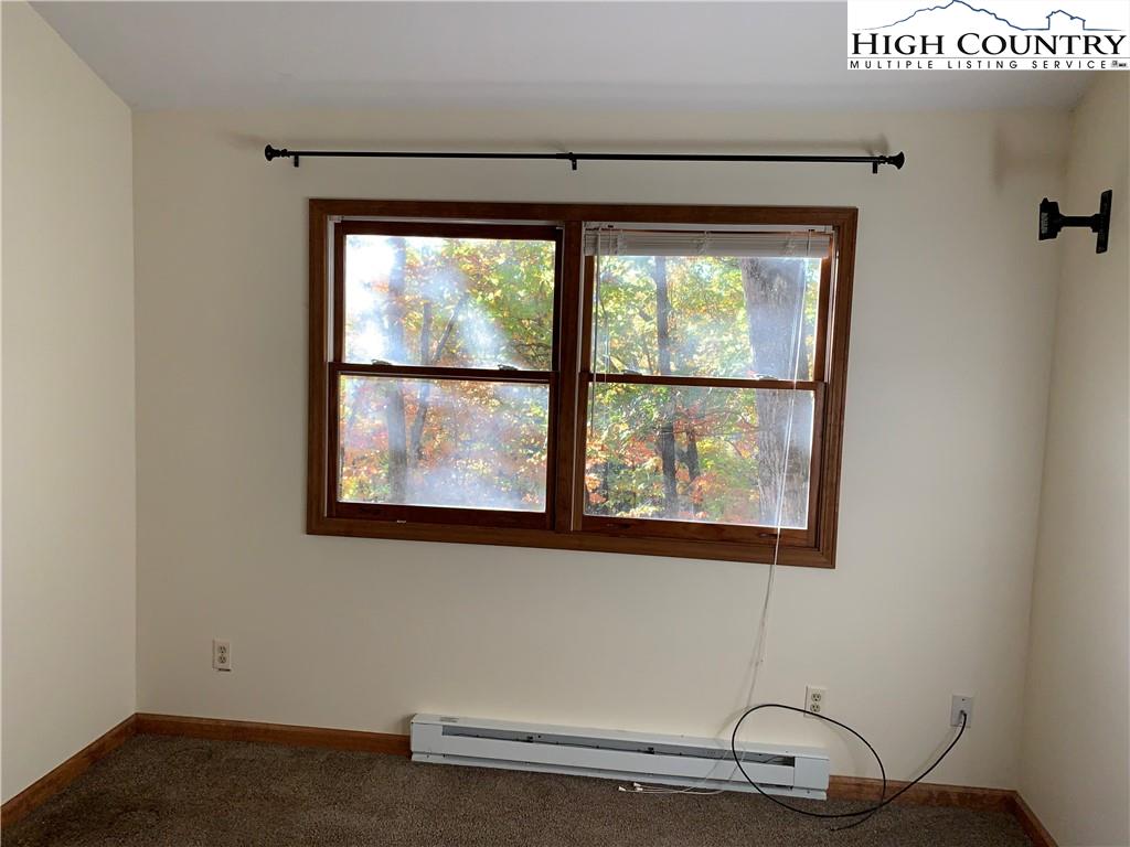 117 Horseshoe Ridge Road East Deep Gap, NC 28618 - Photo 31 of 50 a room with a window
