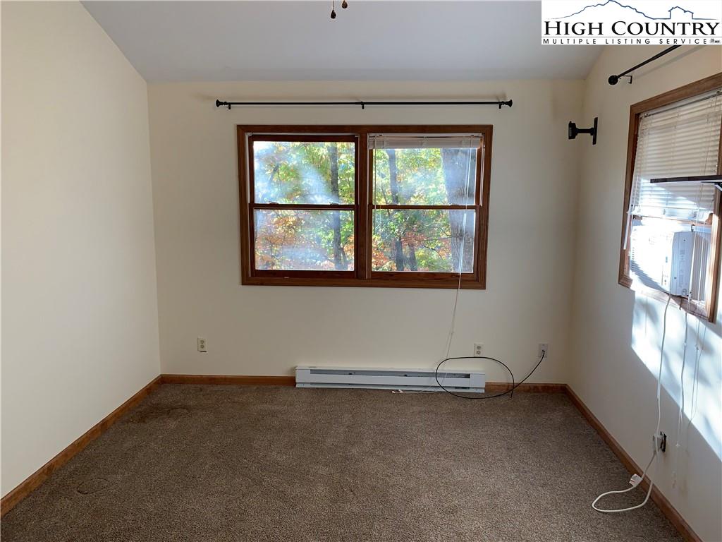 117 Horseshoe Ridge Road East Deep Gap, NC 28618 - Photo 36 of 50 an empty room with a window