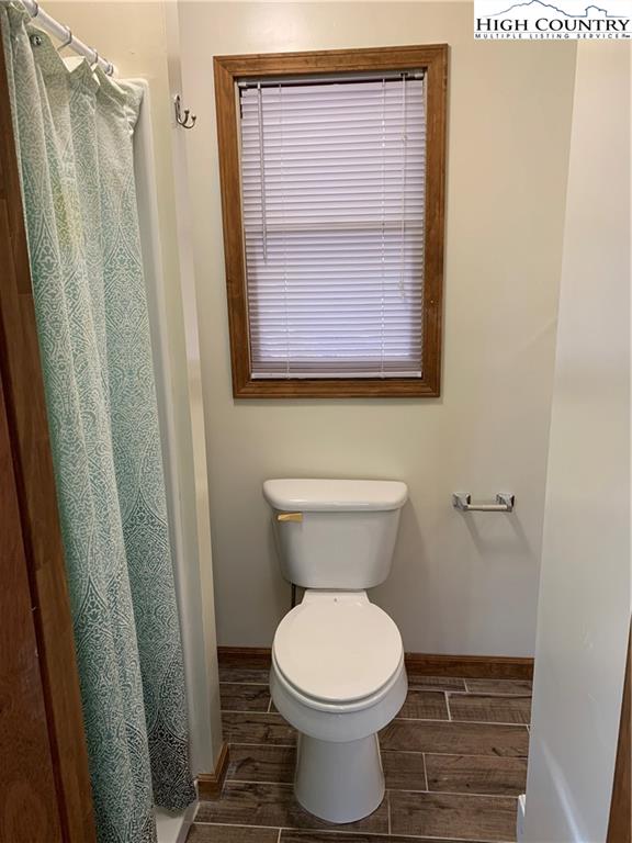 117 Horseshoe Ridge Road East Deep Gap, NC 28618 - Photo 39 of 50 a bathroom with a toilet and a sink