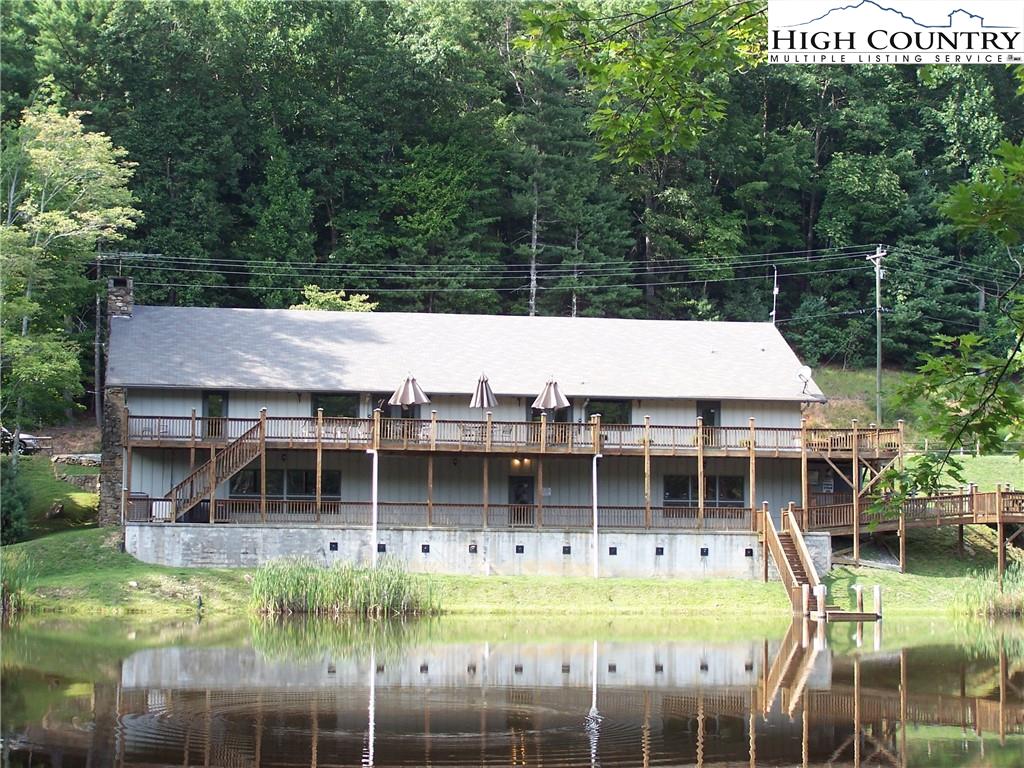 117 Horseshoe Ridge Road East Deep Gap, NC 28618 - Photo 49 of 50 a aerial view of a house with a swimming pool