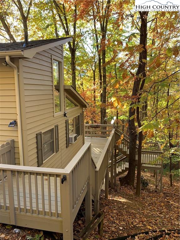 117 Horseshoe Ridge Road East Deep Gap, NC 28618 - Photo 5 of 50 a view of wooden house with a trees