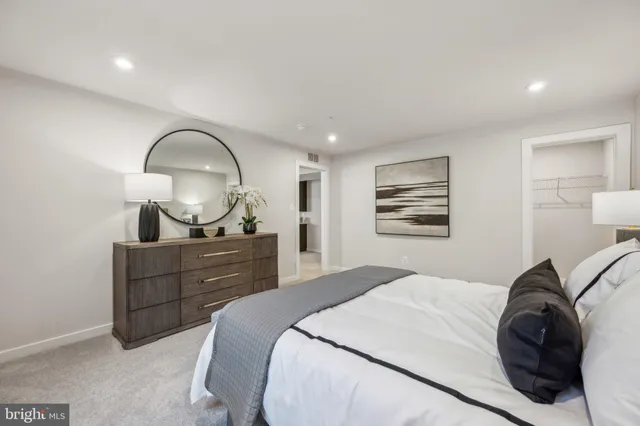 a bedroom with a bed and a dresser