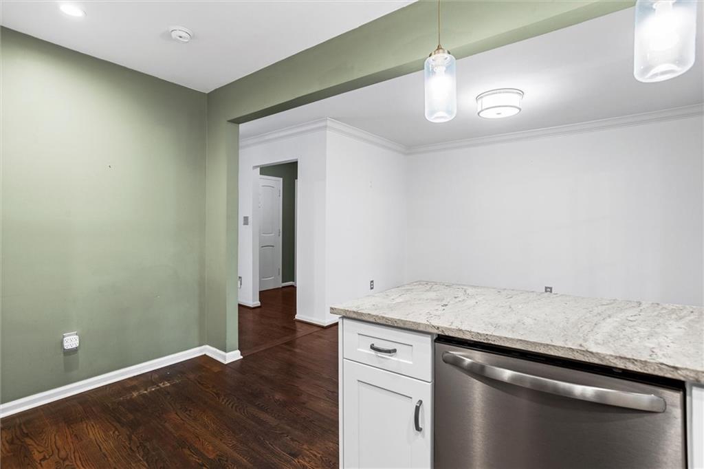 144 Woodmere Square Northwest Atlanta, GA 30327 - Photo 12 of 39 a view of a kitchen cabinets and wooden floor