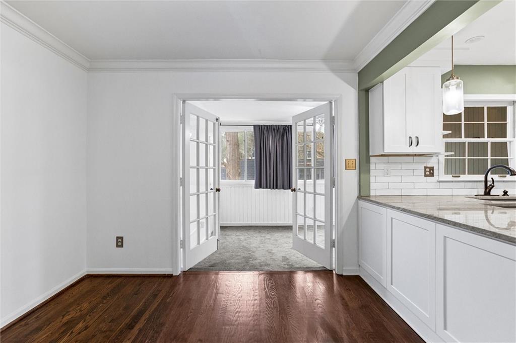 144 Woodmere Square Northwest Atlanta, GA 30327 - Photo 13 of 39 a view of a kitchen from a hallway