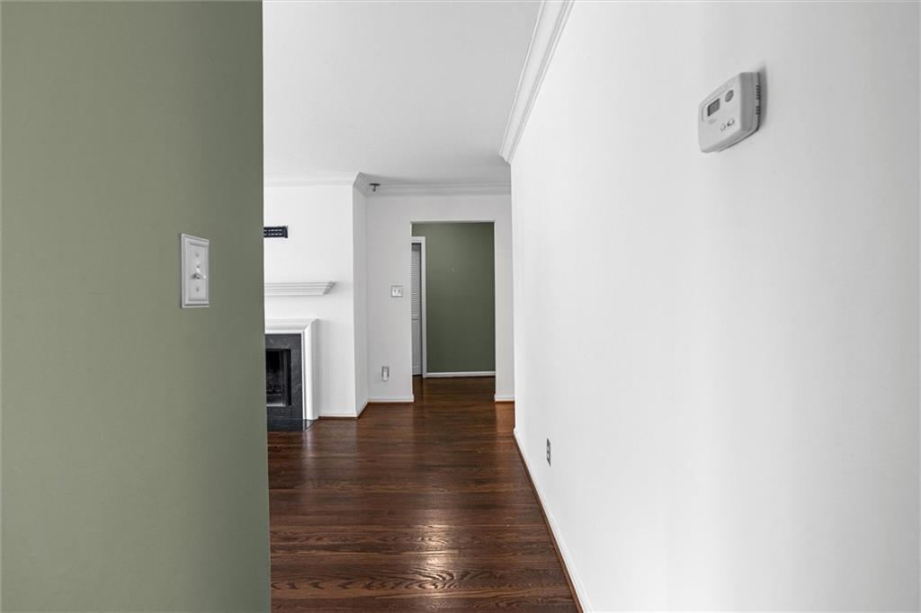 144 Woodmere Square Northwest Atlanta, GA 30327 - Photo 26 of 39 a view of a hallway with wooden floor