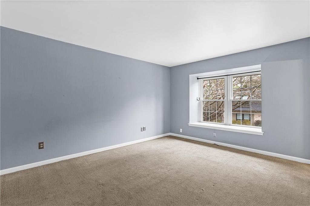 144 Woodmere Square Northwest Atlanta, GA 30327 - Photo 27 of 39 an empty room with a window