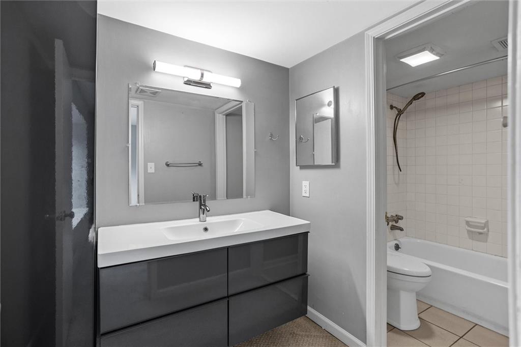 144 Woodmere Square Northwest Atlanta, GA 30327 - Photo 30 of 39 a bathroom with a sink toilet and shower