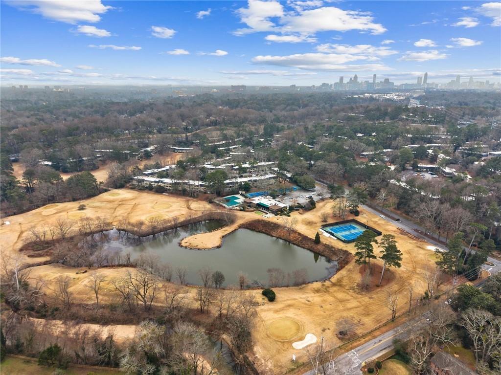 144 Woodmere Square Northwest Atlanta, GA 30327 - Photo 3 of 39 a view of a swimming pool with a yard
