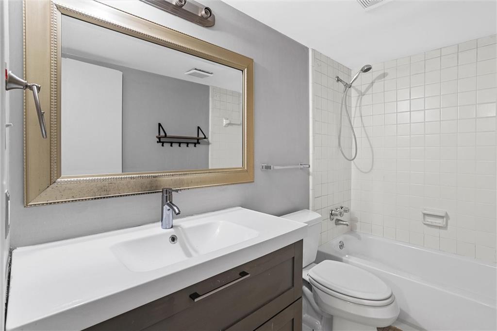 144 Woodmere Square Northwest Atlanta, GA 30327 - Photo 32 of 39 a bathroom with a sink a toilet and shower
