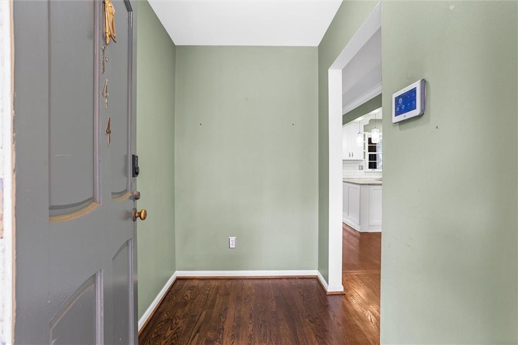 144 Woodmere Square Northwest Atlanta, GA 30327 - Photo 5 of 39 a view of room with wooden floor