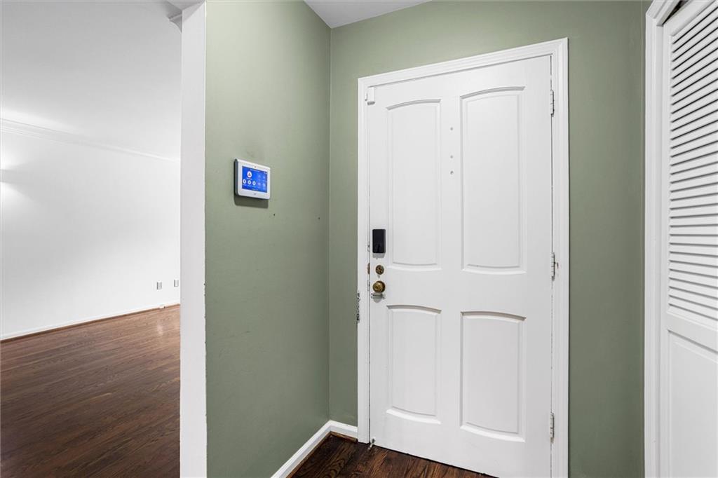 144 Woodmere Square Northwest Atlanta, GA 30327 - Photo 6 of 39 an entryway with wooden floor