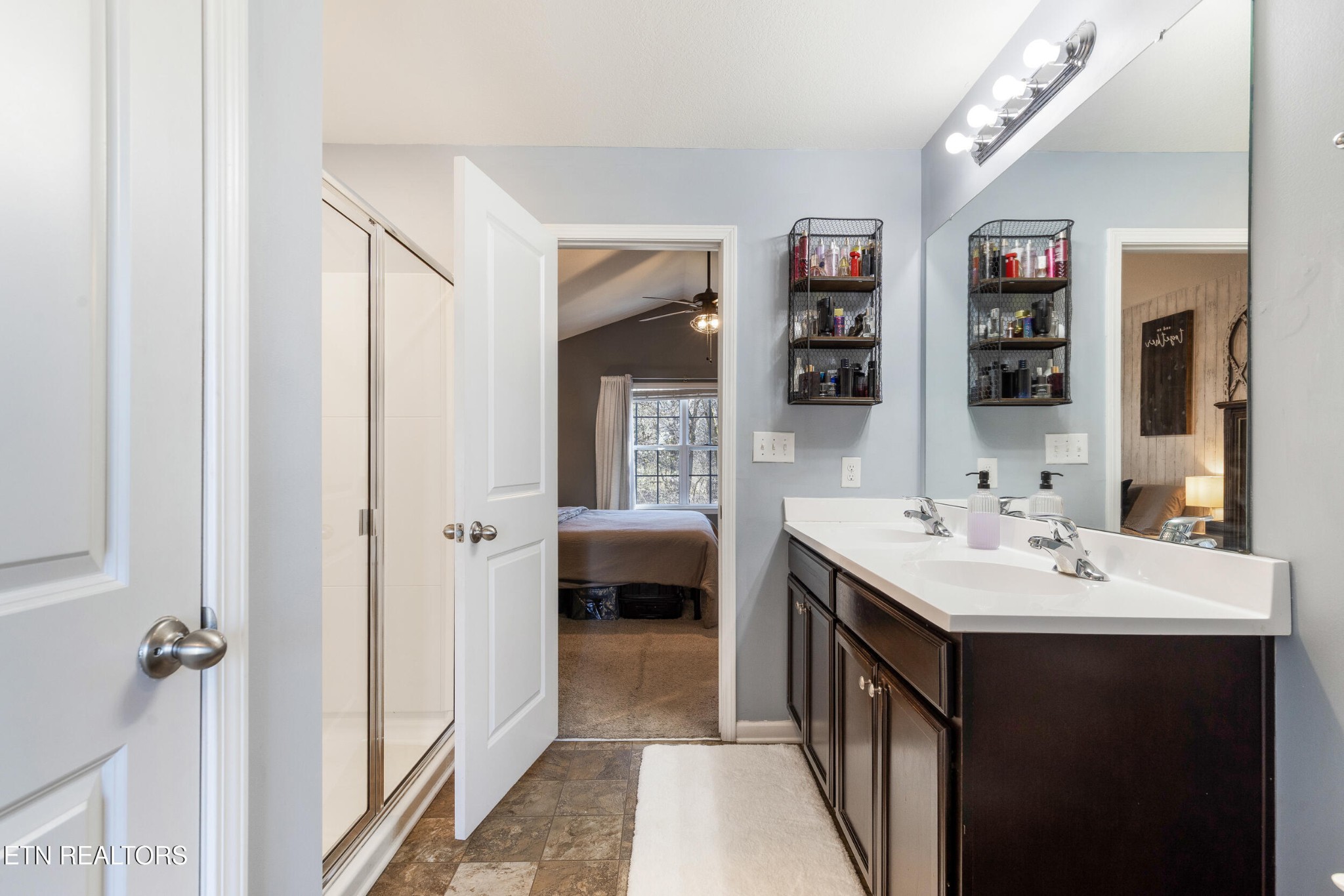 7200 Ponds Inlet Lane Powell, TN 37849 - Photo 18 of 38 a en suite bathroom with a double vanity sink and a mirror