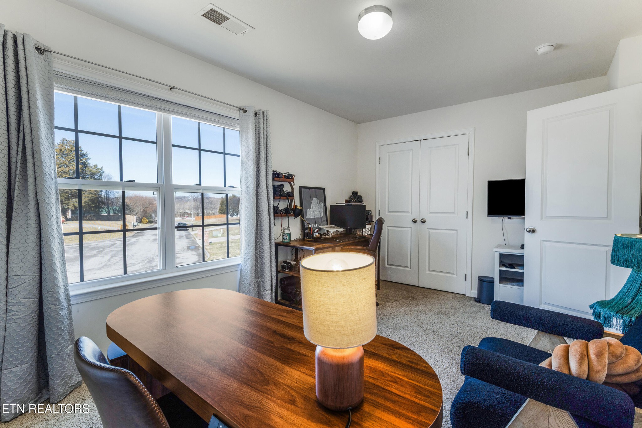 7200 Ponds Inlet Lane Powell, TN 37849 - Photo 23 of 38 a living room with furniture and a flat screen tv