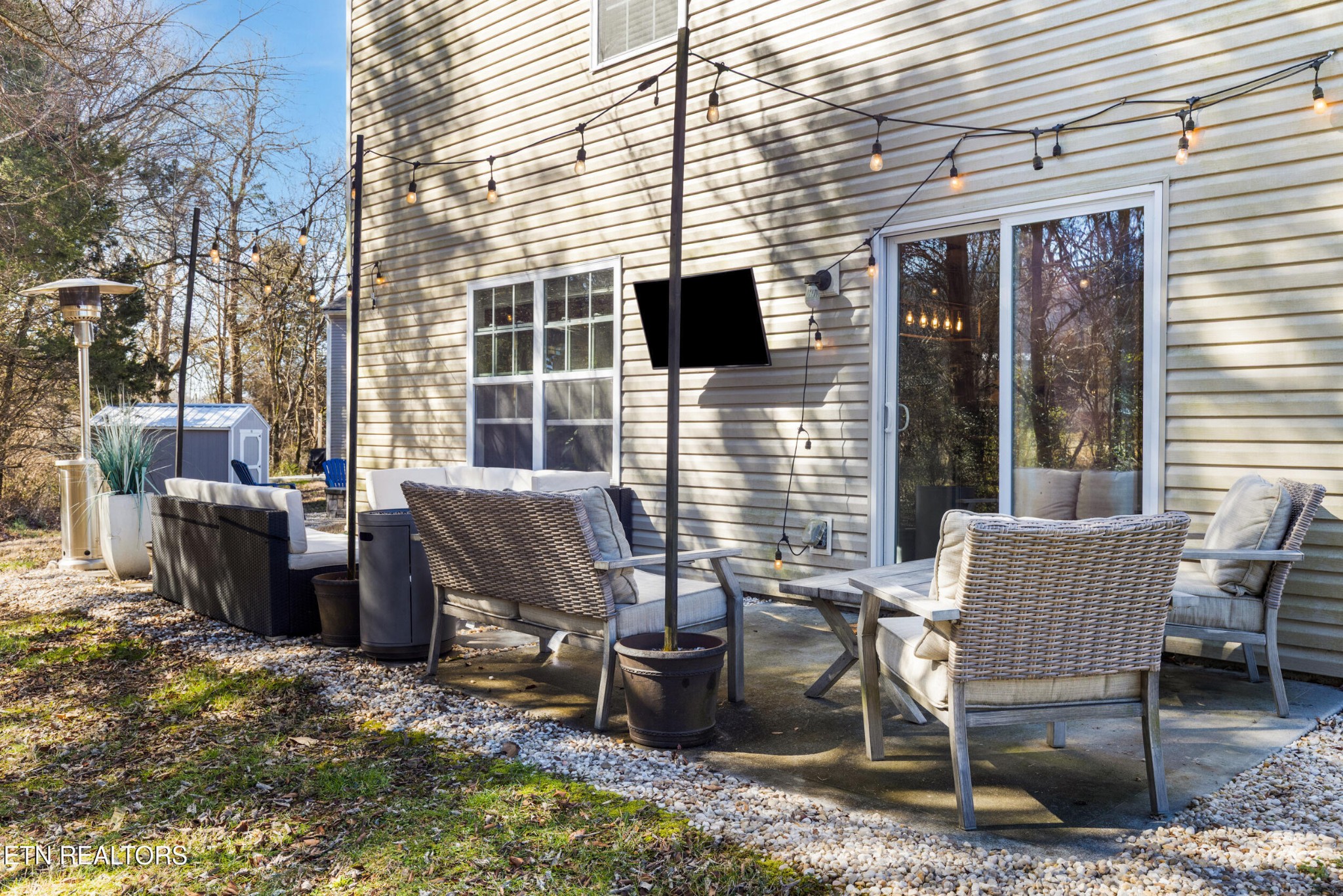 7200 Ponds Inlet Lane Powell, TN 37849 - Photo 26 of 38 a backyard of a house with barbeque oven table and chairs